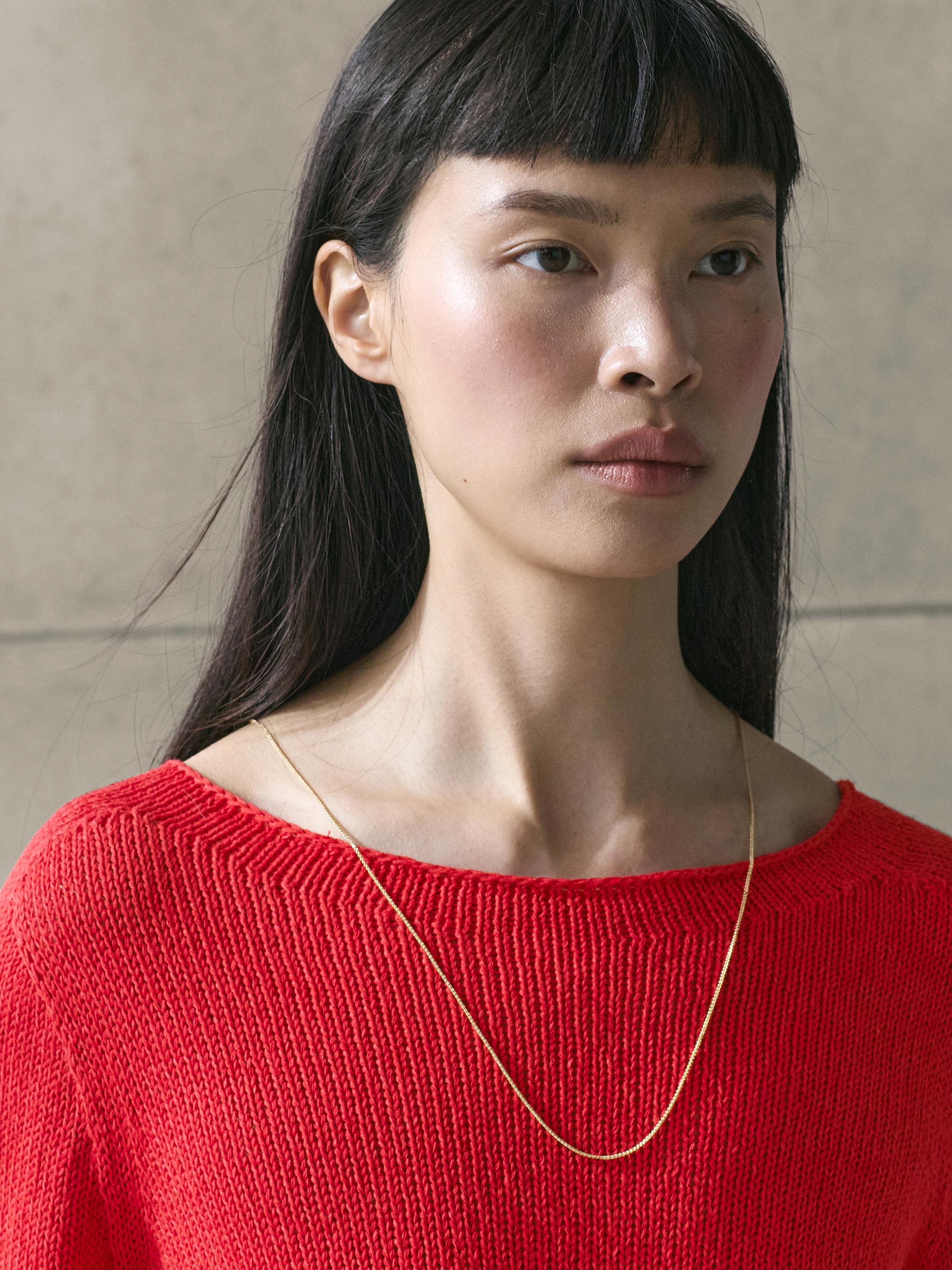 Asymmetric knit sweater